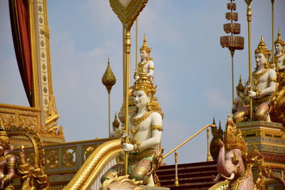 Statue of temple outside building