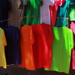 Multi colored clothes hanging in kitchen