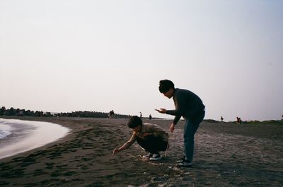 Friends enjoying at beach