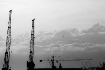 Low angle view of crane against sky