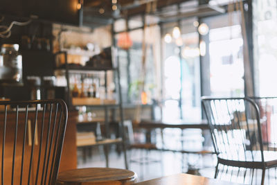 Interior of the restaurant cafe with transparent glass walls. empty coworking space. defocused