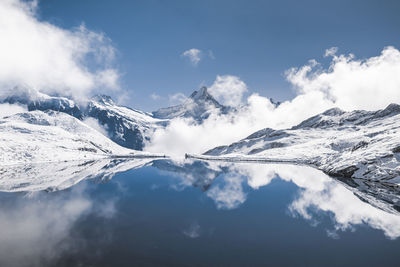 Scenic view of snowcapped mountains against sky at bachalpsee, switzerland.