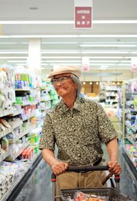 Senior man shopping at supermarket