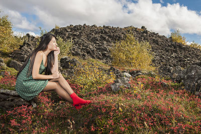 Beautiful woman relaxing at icelandic meadow