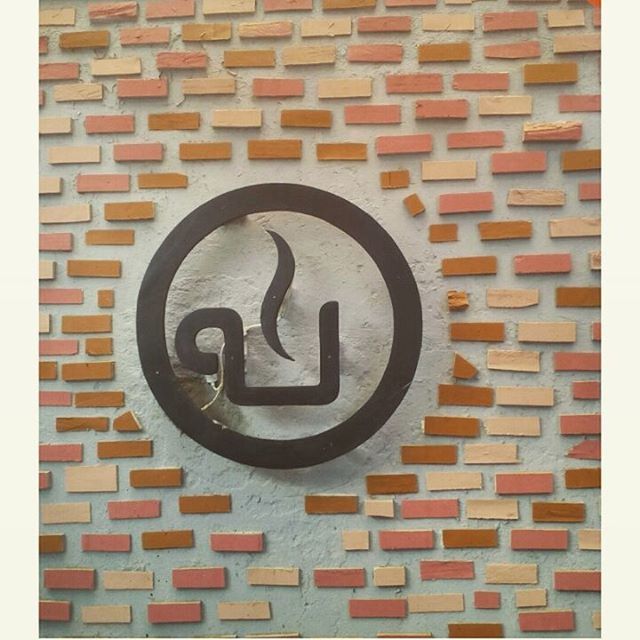 architecture, built structure, wall - building feature, communication, building exterior, brick wall, transfer print, text, circle, geometric shape, wall, sign, western script, close-up, auto post production filter, red, art and craft, pattern, day, no people