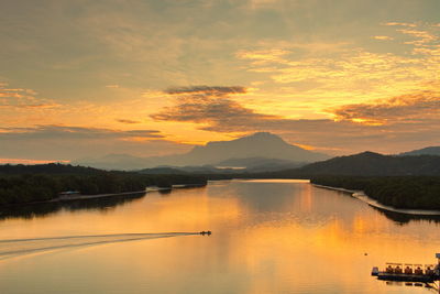 Scenic view of lake against sky during sunset