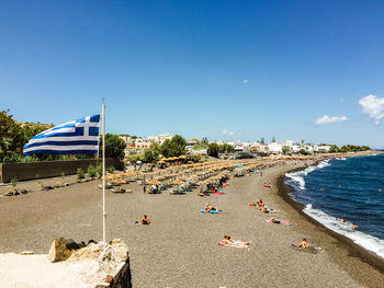 Scenic view of beach against blue sky