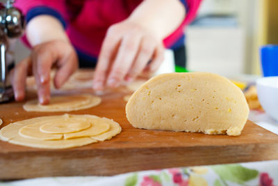 Close-up of preparing food on table in kitchen