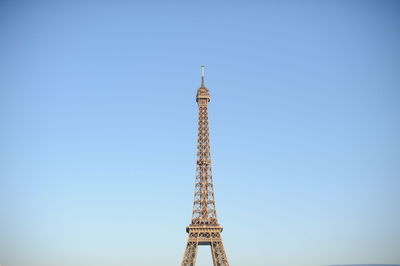 Low angle view of eiffel tower against clear blue sky