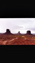 Rock formations on landscape against sky