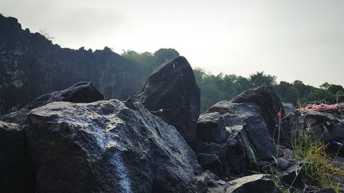 Panoramic view of rocks on land against sky