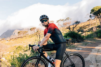 Man riding bicycle on mountain