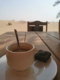 Close-up of coffee cup on table