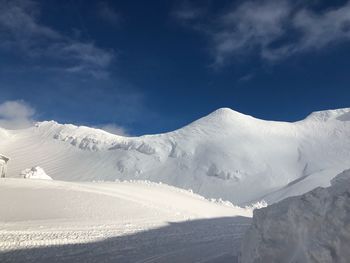 Snow covered mountain against sky