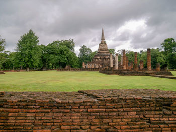 View of old building against cloudy sky