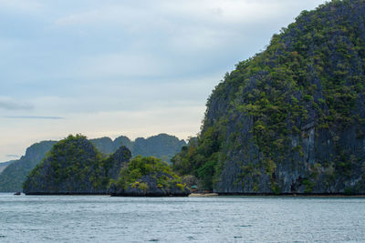 Photo showcases the stunningly rugged coastline of the philippines. a series of rocky outcroppings.