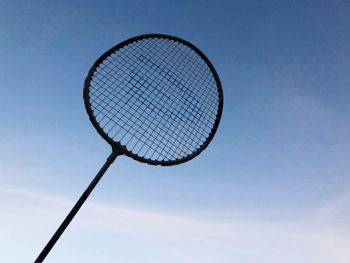 Low angle view of basketball hoop against blue sky