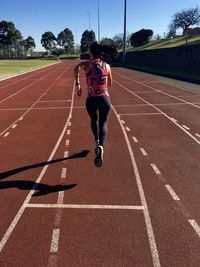 Full length of man running on road