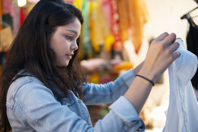 Portrait of young woman looking away