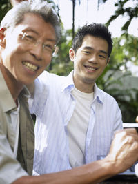 Portrait of smiling father and son