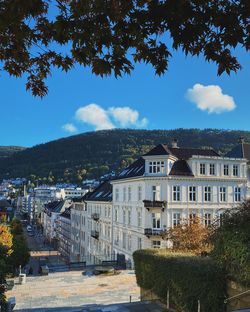 Buildings in town against sky