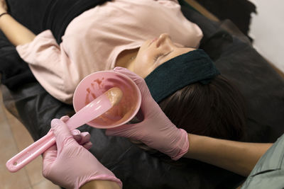 Midsection of man holding drink