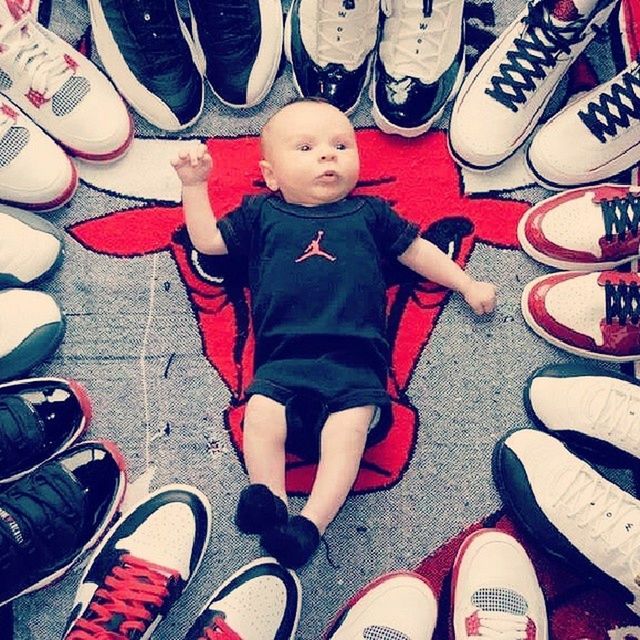 high angle view, childhood, shoe, leisure activity, lifestyles, casual clothing, boys, multi colored, directly above, sitting, elementary age, indoors, low section, person, innocence, standing, girls, large group of objects