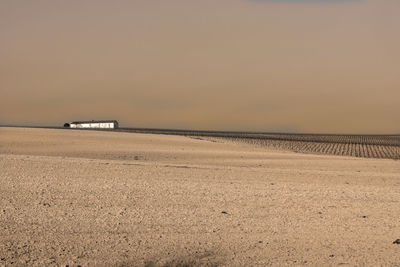 Scenic view of beach against clear sky