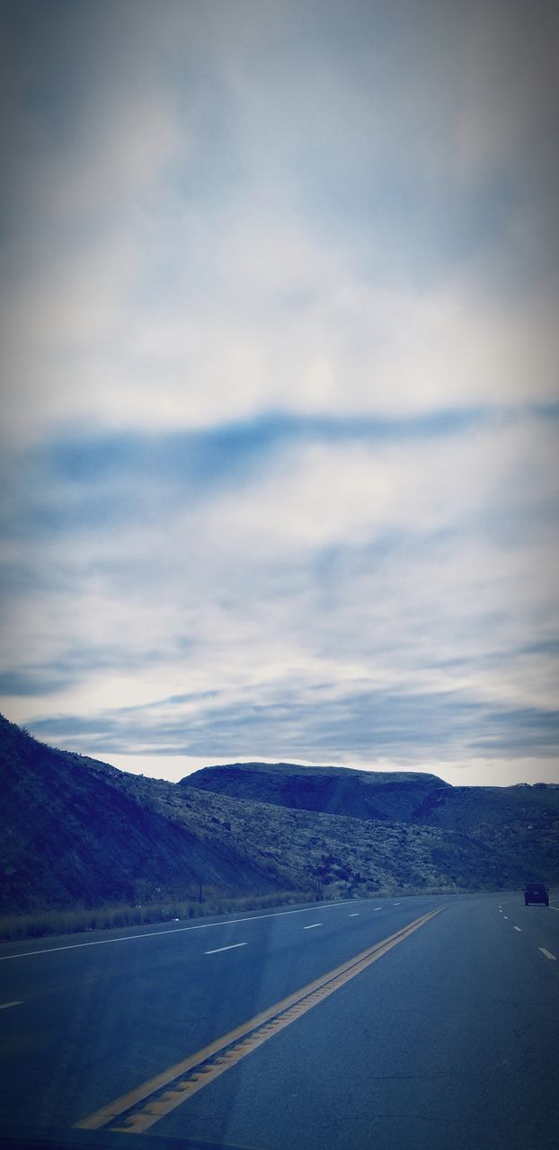 ROAD BY MOUNTAIN AGAINST SKY