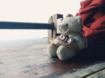 Close-up of cropped hand holding wood