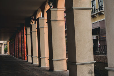 Street light on footpath by building