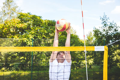 Rear view of woman standing in playground
