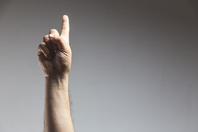 Midsection of person making face against white background