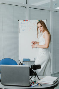 Young woman using mobile phone