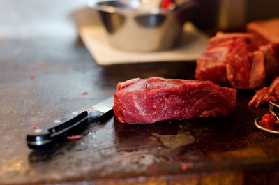 Close-up of meat on cutting board