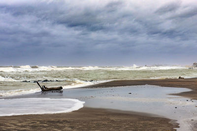 Scenic view of beach against sky