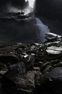 Scenic view of waterfall against sky