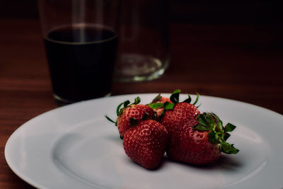 Close-up of strawberry in plate on table