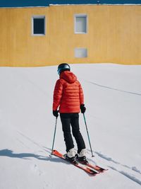 Man skiing on snow covered field