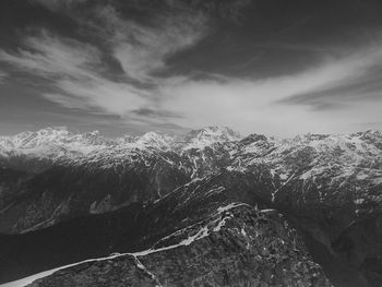 Scenic view of dramatic landscape against sky during winter