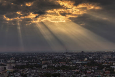 Aerial view of city against sky during sunset