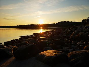 Scenic view of beach against sky during sunset