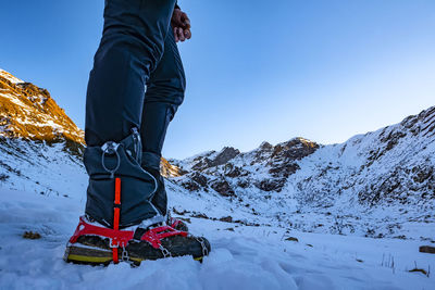 Close-up of trekking boots on the snow