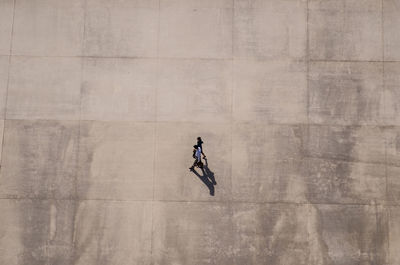 Full length of man with umbrella in city