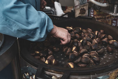 Midsection of man preparing food