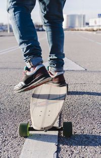 Close-up of anonymous man on longboard