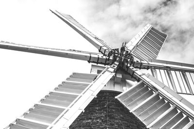 Low angle view of windmill against sky
