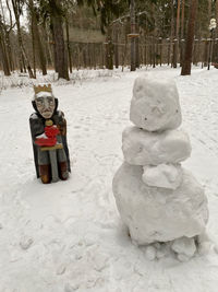 Sculpture on snow covered land