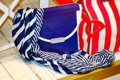 Close-up of flags hanging on floor at home