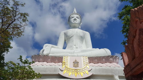 Low angle view of statue against sky